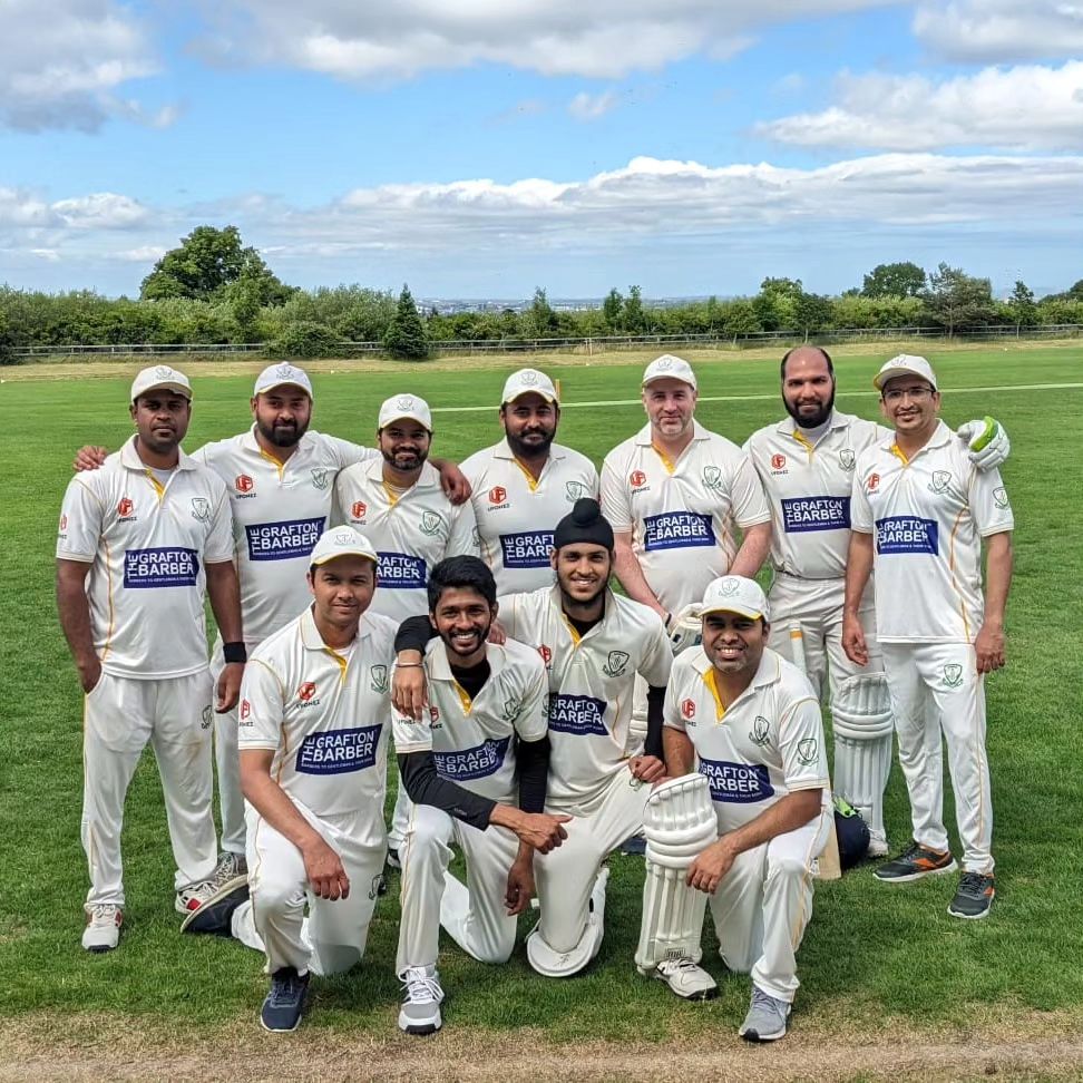 Members of Dundalk local sports Cricket Club posing together in team uniform
