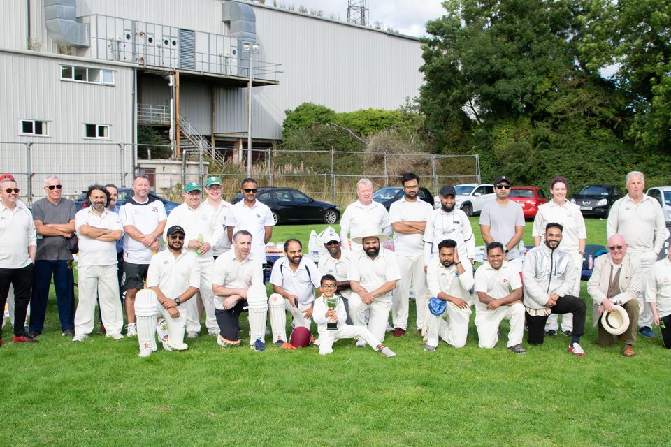 Members of Dundalk Cricket Club posing together in team uniform