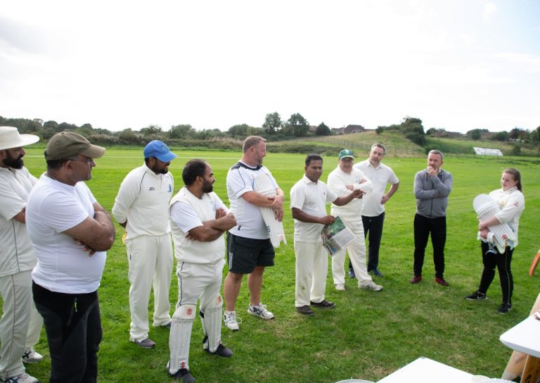 A serene evening scene at Dundalk Cricket Club, with players winding down after a day of cricke