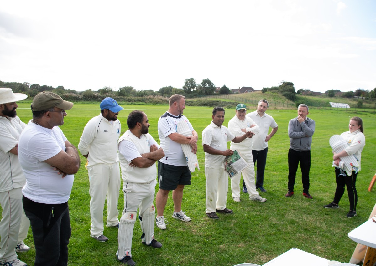 A serene evening scene at Dundalk Cricket Club, with players winding down after a day of cricke